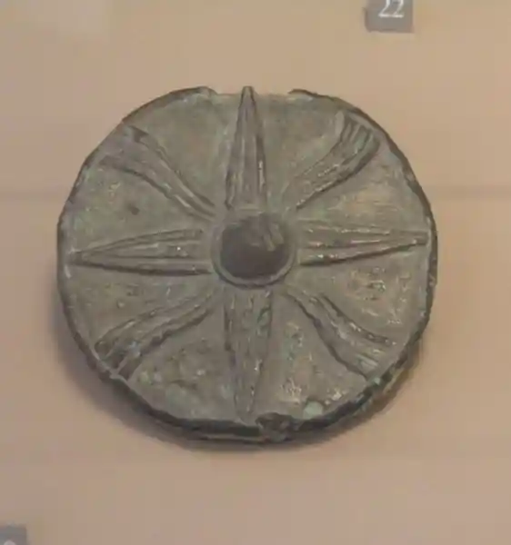 Medallion decorated with bronze star, Susa cross, sun rays